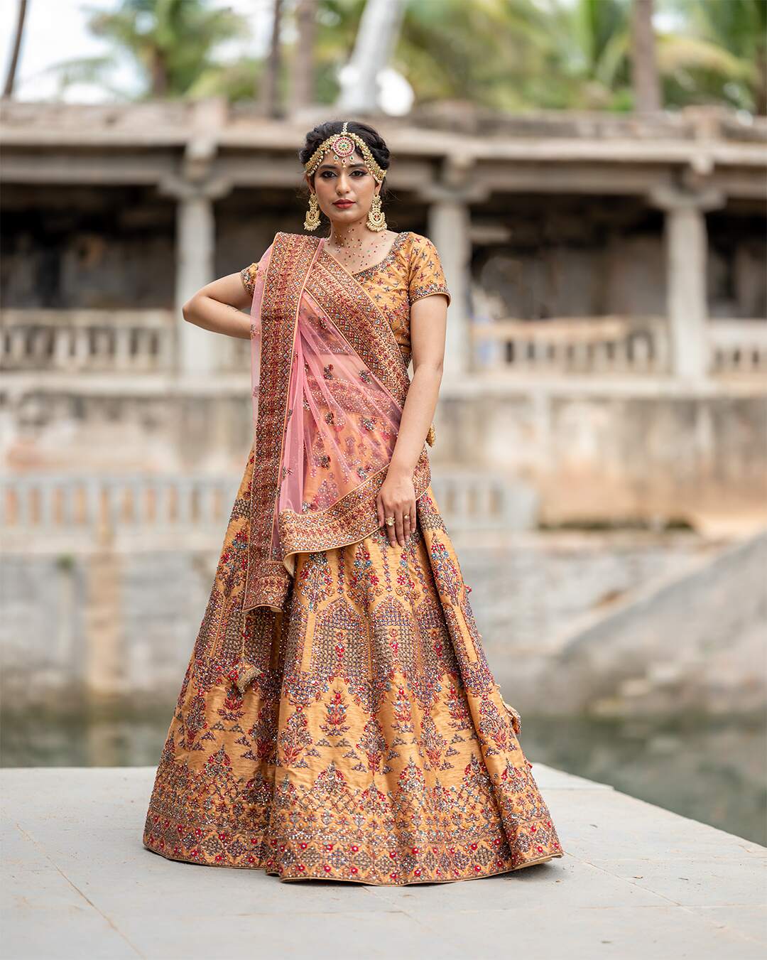 Almond Gold Bridal Lehenga Set With Multicolor Hand Embroidery
