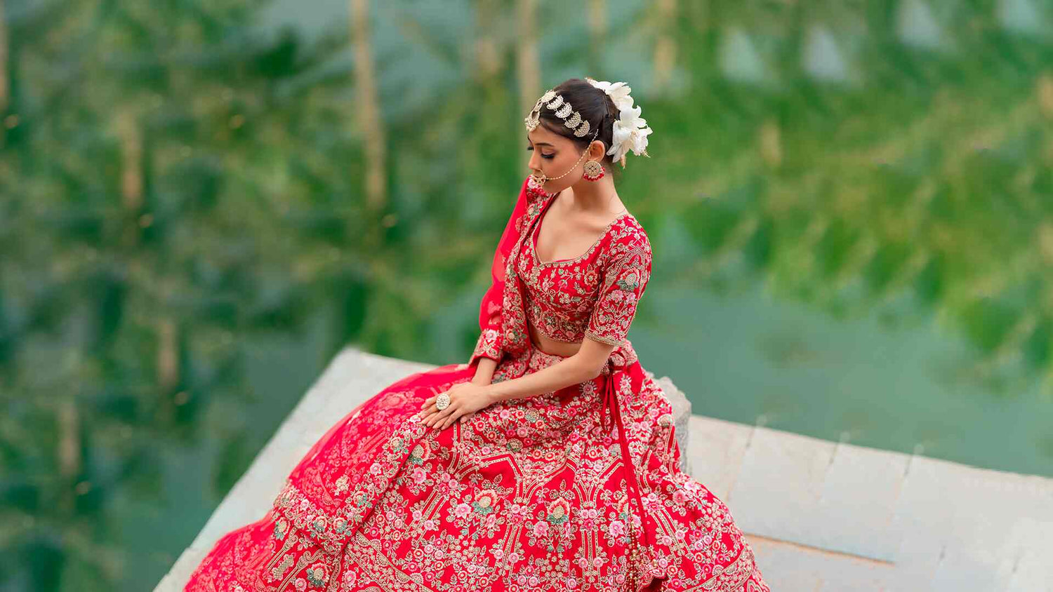 Cover Image for Designer Khushboo Baheti's wesbite featuring a Red Hot Pink Indian Bridal Ethnic Lehenga Set Embroidered with Zardozi and Threadwork using hand embroidery technique.